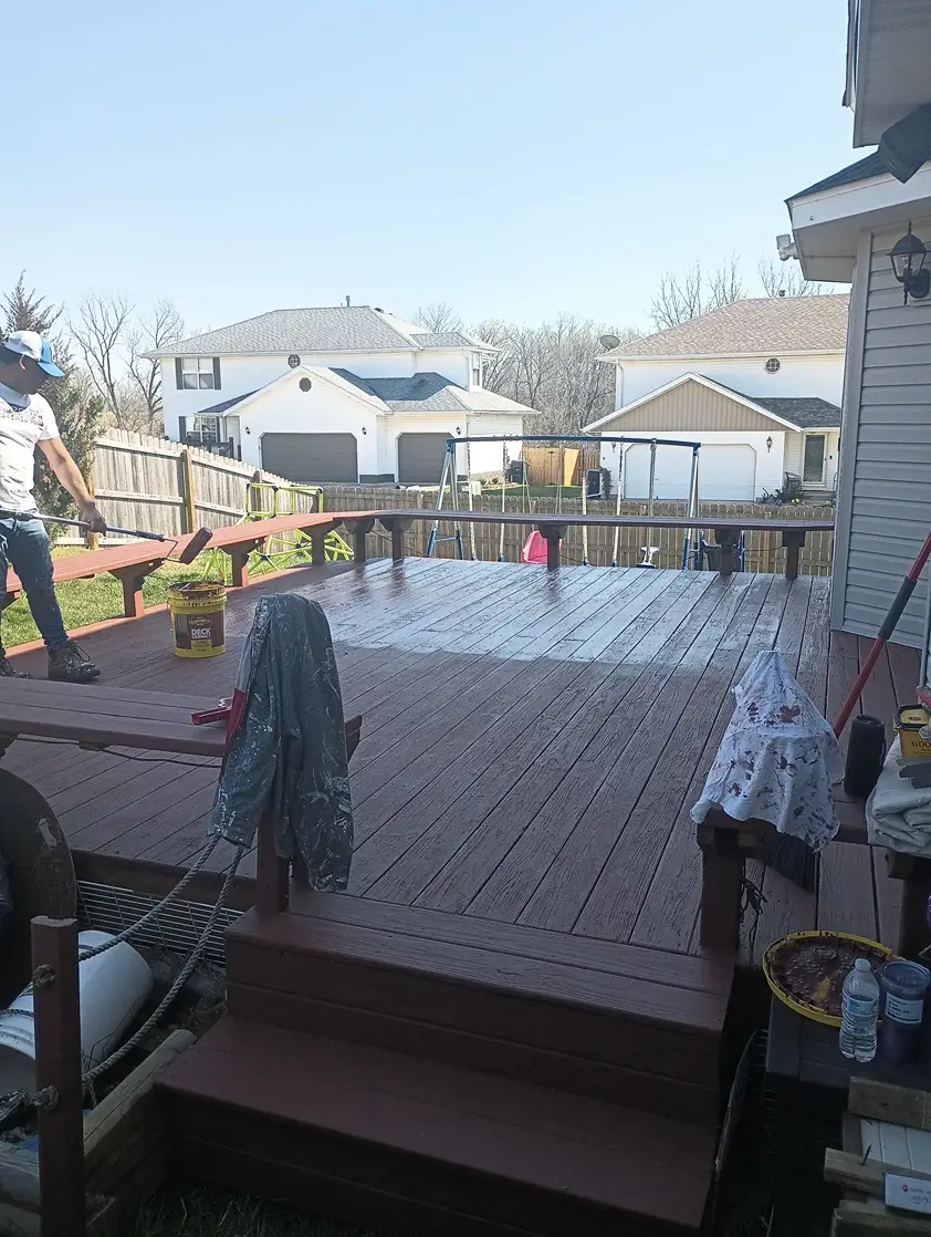 Crew refinishing exterior wood